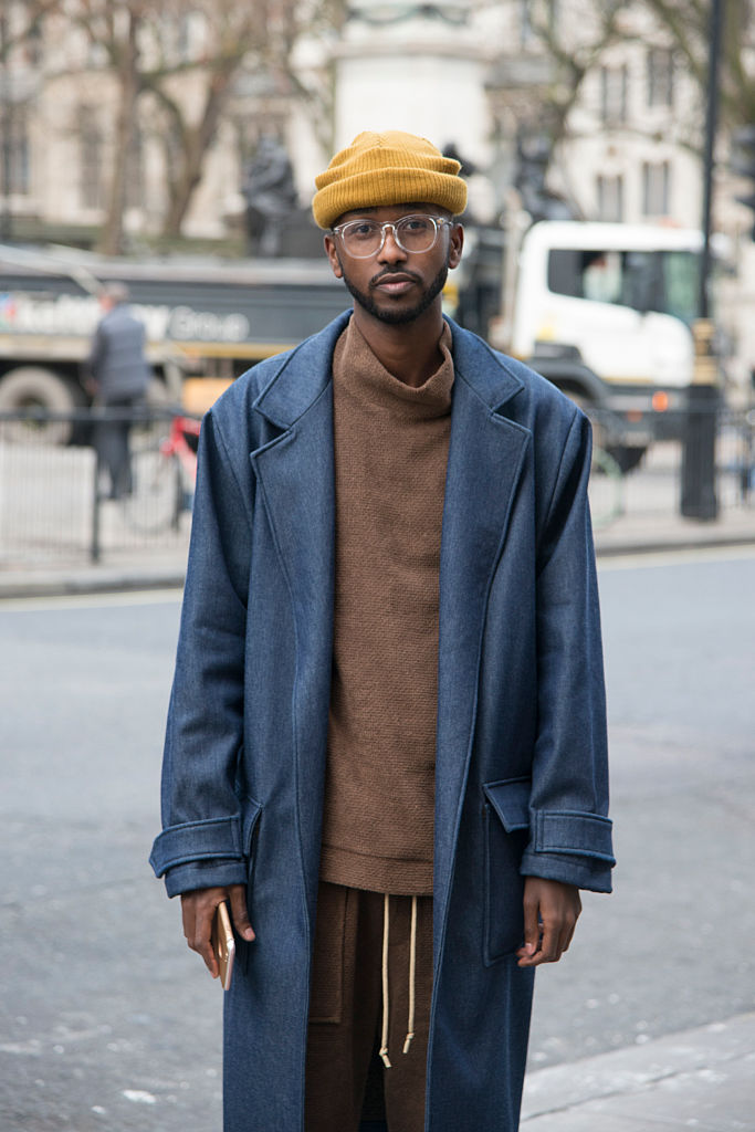 LONDON, ENGLAND - JANUARY 06 : Fashion Blogger Abdul Ali wears Rabbit Hole london top, trousers and jacket and a Top Man hat day 1 of London Mens Fashion Week Autumn/Winterr 2017, on January 06, 2017 in London, England. (Photo by Kirstin Sinclair/Getty Images)